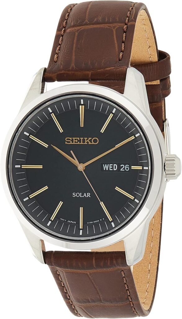 SEIKO Watch for Men - Essentials - with Day/Date Calendar, LumiBrite Hands and Markers, Leather Bracelet, 100m Water-Resistant SEIKO Watch for Men - Essentials - with Day/Date Calendar, LumiBrite Hands and Markers, Leather Bracelet, 100m Water-Resistant
